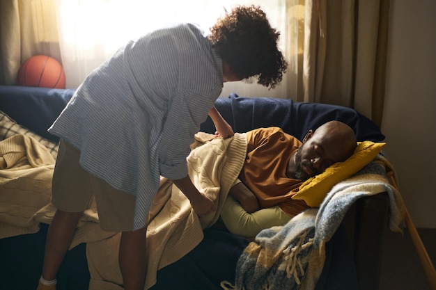 freepicdownloader.com caring elderly african american man cozy room normal