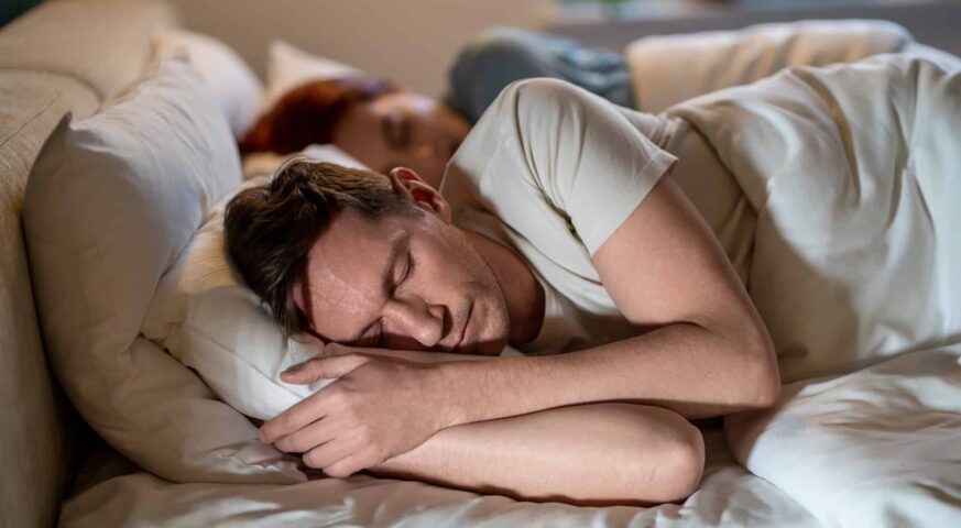 Man and woman sleep soundly well. Importance of long, healthy sleep. Joint sleep of spouses