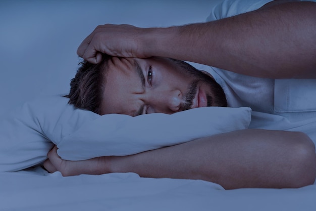 freepicdownloader.com man lying bed trying sleep cant sleep insomnia sleeping problems sleep disorders normal