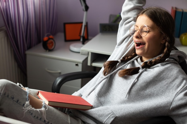 freepicdownloader.com young girl yawns break her school reading normal